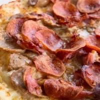 Pizza Carne Amorasso · Italian sausage, prosciutto, garlic, mozzarella cheese & aged Parmesan.