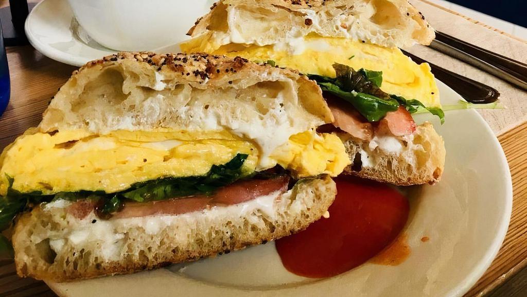 Shepherd Sandwich · Scrambled eggs, goat cheese, tomato, greens, on an everything Philly muffin served with breakfast potatoes.