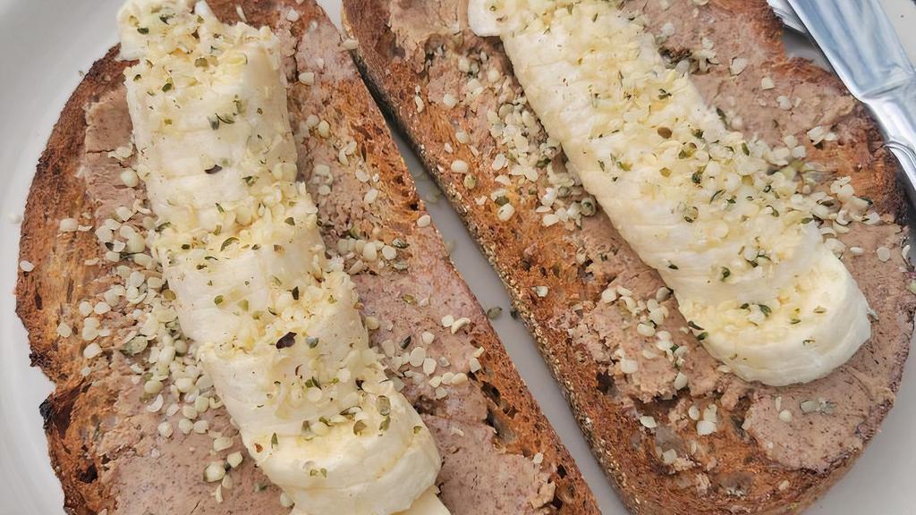 Almond Butter Toast · Vegan. Thick cut wheat toast, almond butter, sliced banana, and hemp seeds.