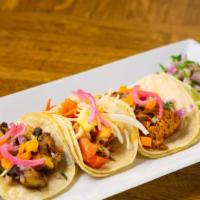 Al Pastor · Gluten-Free. Grilled achiote-marinated pork with pineapple, bacon, pickled red onions, and f...
