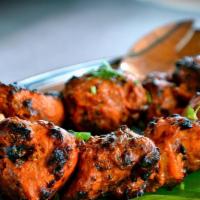  Chicken Tikka Kabab · Medium spiced boneless chicken breast with Aromatic Basmati Rice.