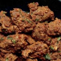 Lamb/Goat Bhuna · Special Thick Gravy in which Lamb or Goat is Cooked with Perfection. Comes with Steam Basmat...