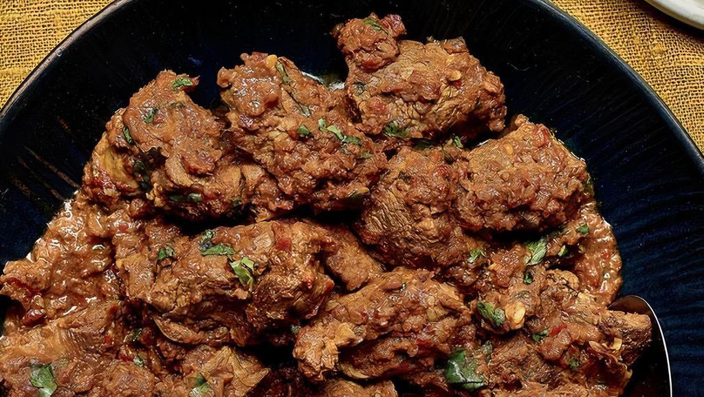 Lamb/Goat Bhuna · Special Thick Gravy in which Lamb or Goat is Cooked with Perfection. Comes with Steam Basmati Rice