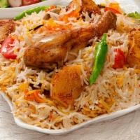 Chicken Biryani · House Special Rice Dish Made With Aromatic Basmati Rice And Chef's Secret Ingredients. Serve...