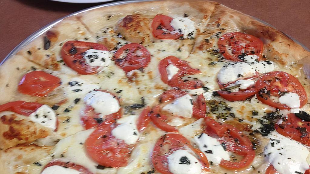 Capri Sicilian Pizza · 8 Slices. Fresh mozzarella, tomatoes, basil in a garlic oil sauce.