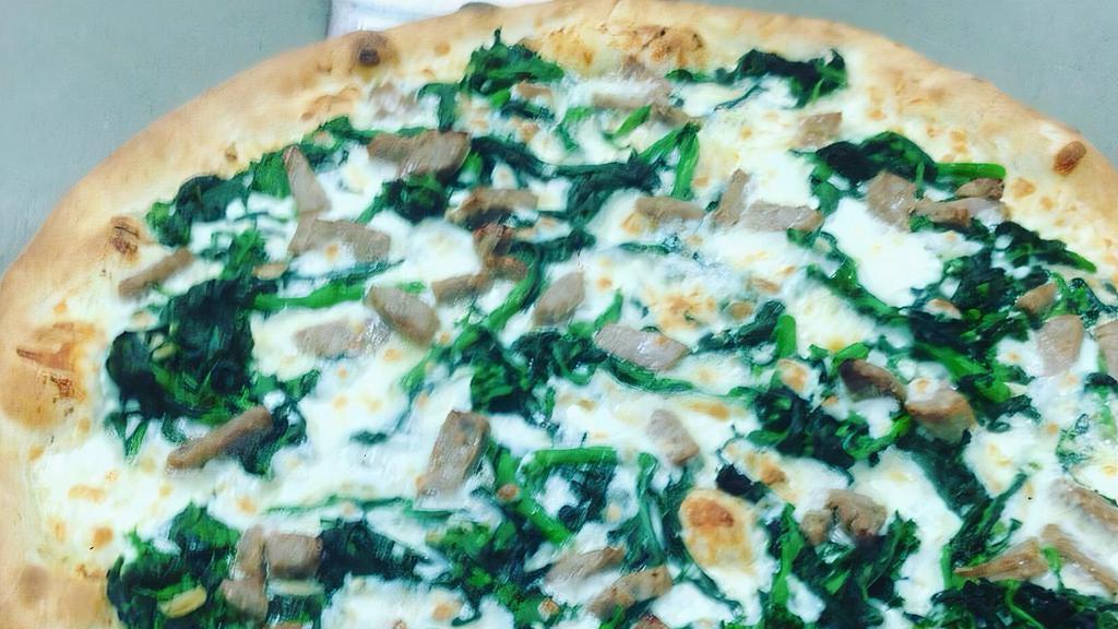 Mediterranean Pizza · Feta cheese, spinach, black olives, fresh garlic.