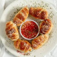 Garlic Rolls · 6 Pieces. With side sauce.