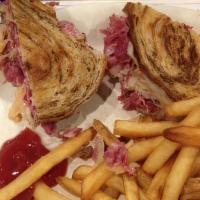 Reuben* · A traditional favorite. Corned beef, sauerkraut, Russian dressing and cheese served on marbl...