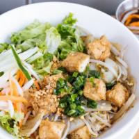 Tofu & Lemongrass Vermicelli · Stir-fried tofu, lemongrass, onion, and bean sprout. Served with lettuce, mint, cucumber, an...