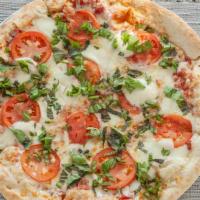 Margherita Pizza · Fresh mozzarella, tomato, basil, and tomato sauce.