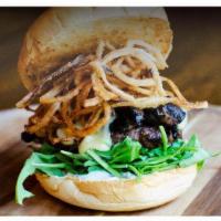 Shroom Truffle Burger · Freshly ground burger topped with Swiss cheese, grilled portabella mushroom, arugula, and sh...