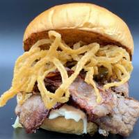Smoked Brisket Sandwich · Smoked brisket topped with coleslaw and shredded fried onions on a brioche bun.
