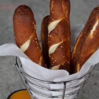 Bavarian Pretzel Sticks · Whipped maple butter, creamy honey mustard & queso