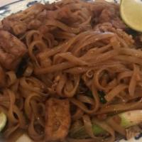 Pad Thai · Hot and Spicy. Stir-fried Thai noodles with egg, bean sprouts, dry tofu and topped with grou...