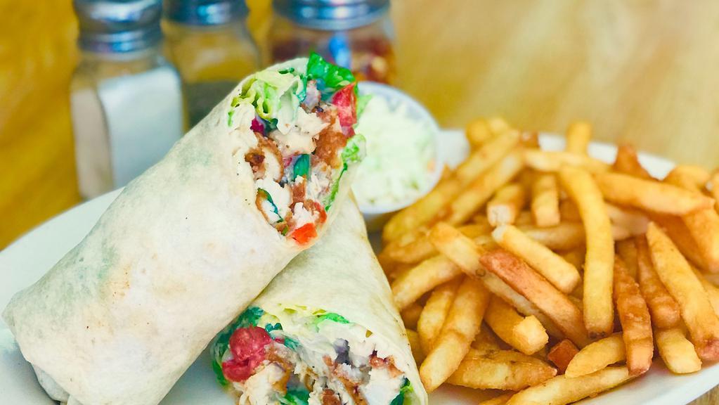 Grilled Chicken Caesar Wrap · Romaine lettuce, , parmesan cheese and caesar dressing. Served with french fries, pickles and coleslaw.
