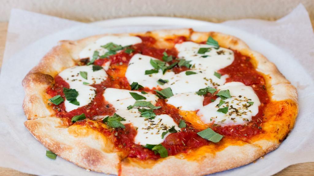 Margherita Pizza · Plum tomatoes, fresh mozzarella, basil, fresh garlic.