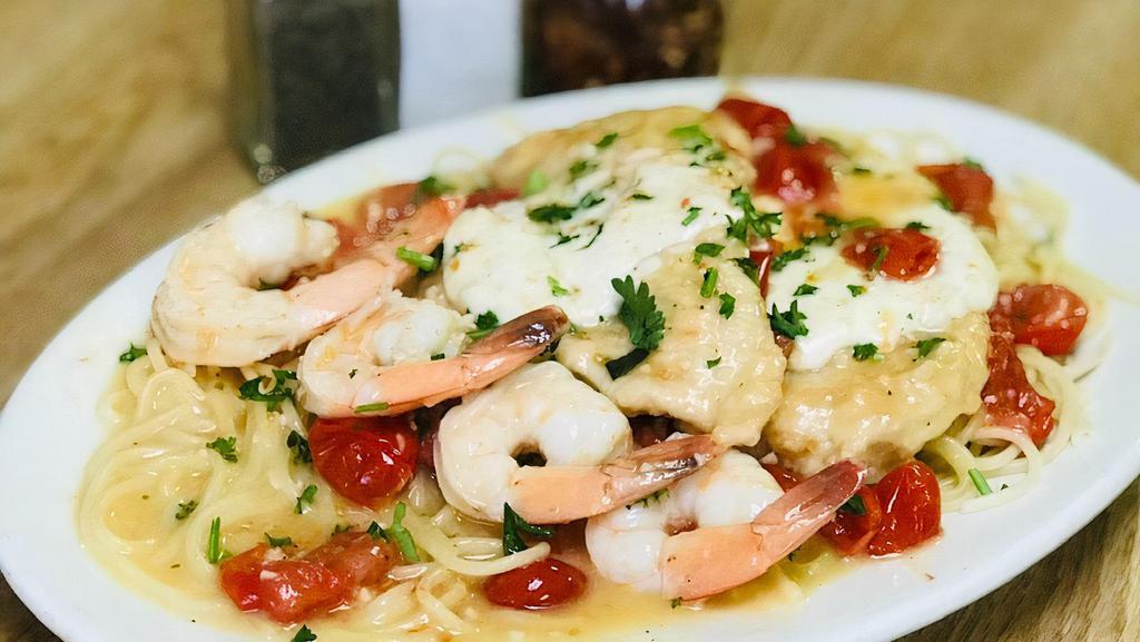 Chicken And Shrimp Sofia · Sautéed chicken and shrimp in garlic and olive oil with chopped tomatoes in a white wine sauce topped with fresh mozzarella. Served with soup or salad, side of pasta and garlic knots.