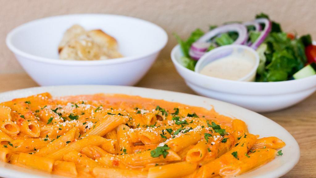Penne Alla Vodka · in a vodka cream sauce. Tossed with penne. Served with soup or salad, side pasta and garlic knots.