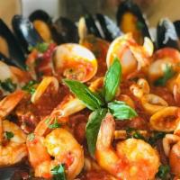 Seafood Frutti Di Mare · Sautéed mussels, clams, shrimp and calamari with garlic in a zesty marinara sauce, served ov...