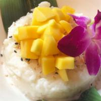 Mango Sticky Rice · Sweet Coconut rice, ripe mangos and crispy coconut flakes
