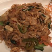 Padd Kea Mow (Drunken Noodles) · Wide rice noodles stir-fried in a garlic chili sauce with egg, mixed vegetables and thai bas...