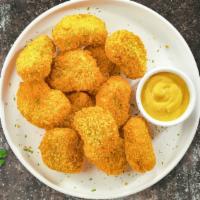Chicken Nuggets League · 24 pieces. Bite sized nuggets of chicken breaded and fried until golden brown. Served with y...