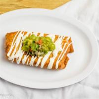 Chimichanga · Crispy fried burrito topped w/guac & sour cream.