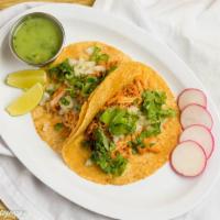 Tacos Tonatico · Three handmade corn tortillas onions, cilantro, lime.