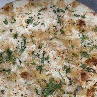 Garlic Naan · Leavened, handmade white bread made with garlic, herbs, and Indian spices.