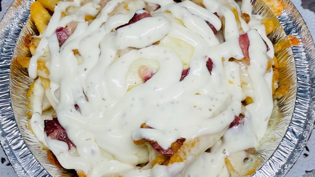 Texas French Fries · with Bacon, Mozzarella cheese & Ranch dressing