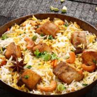 Lamb Mugalai Biryani - ਲੇਲੇ ਮੁਗਲੈ ਬਿਰੀਆਨੀ · Spiced pieces of lamb slow cooked with long grain basmati rice flavored with exotic spices a...