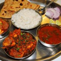 Amritasari Thali - ਅਮ੍ਰਿਤਸਾਰੀ ਥਾਲੀ · Choice of 1 chicken entree and 1 meat entree. Served with basmati rice and 2 made-to-order t...