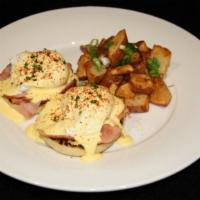 Eggs Benedict · Two poached eggs, toasted English muffin with shaved ham and hollandaise sauce. Served with ...