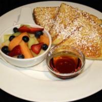 Traditional French Toast · Thick sliced french bread dipped in cinnamon egg wash, griddled golden brown, dusted with ic...