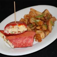 Breakfast Wrap · Scrambled eggs, bacon, mixed cheese and pic de gallo wrapped in a tomato tortilla. Served wi...