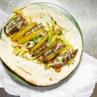 Lamb Kebab Sandwich · Served on pita bread or with rice with a variety of side.