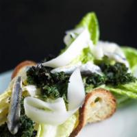 Caesar · Romaine, provolone cheese, white anchovies, and crouton.