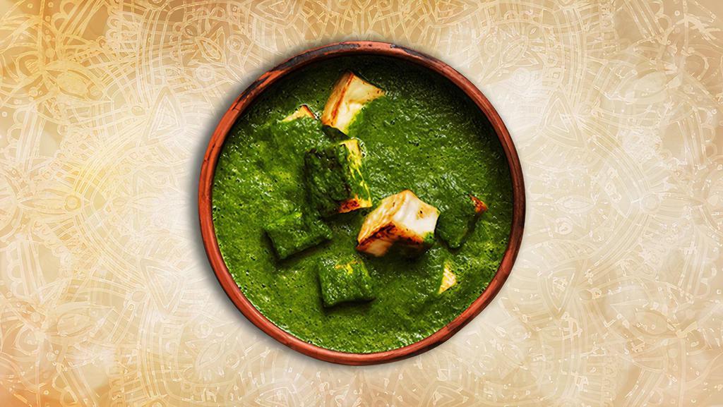 Cottage Cheese & Spinach · Indian cottage cheese cubes in a mild, spiced smooth spinach sauce and creamy dish is made with fresh spinach leaves, paneer (firm cottage cheese), onions, tomatoes, herbs and spices.