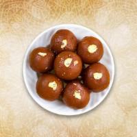 Classic Gulab Jamun  · Deep fried dumplings soaked in a sweet, sticky sugar syrup with the delicate rose flavor
