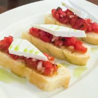 Bruschetta  · Chopped  Roma  tomatoes, basil, red onions, extra virgin olive oil and dry ricotta cheese. (...