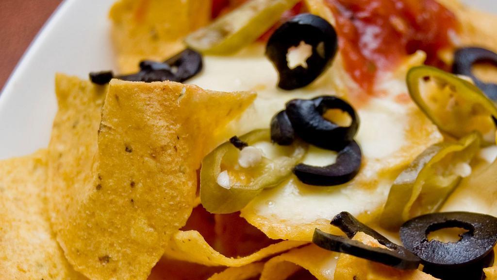 Nachos · Tortilla chips with queso, black beans, cheese, pico de gallo, onion, cilantro, jalapeno and corn. Choice of protein.