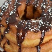 Donut French Toast · Two of our famous honey dipped donuts dipped in our signature french toast dip and griddled....