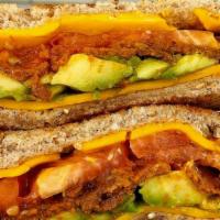 Vegan Hummus Blt · Plant based bacon(Sweet Earth), lettuce, tomatoes and hummus on multigrain toast. Served wit...