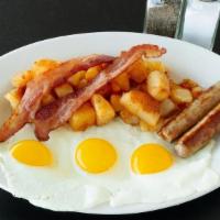 The Hungry Man · Three eggs any style, two sausage links, two strips of bacon, homefries and buttered toast. ...