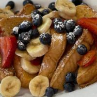 All Fruit French Toast · Topped with bananas, strawberries and blueberries and powder sugar