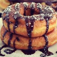 Donut French Toast · Two fresh honey dipped donuts dipped in our house french mix. topped with powdered sugar and...
