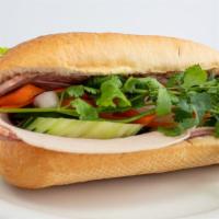 Vietnamese Sandwich · Pate, pickled vegetables, pepper, cucumber, cilantro with pork or chicken or tofu stuffed in...