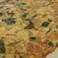 Veggie Frittata · Onions, peppers, tomatoes, spinach, broccoli, mushrooms & roasted red peppers.