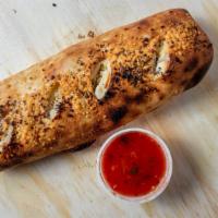 The Peel Calzone · Rolled fresh and stuffed with mozzarella ricotta and your choice of toppings. served with a ...