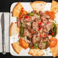 Kabob · Cubes of beef or pork or chicken marinated with herbs and skewered with tomatoes, peppers an...